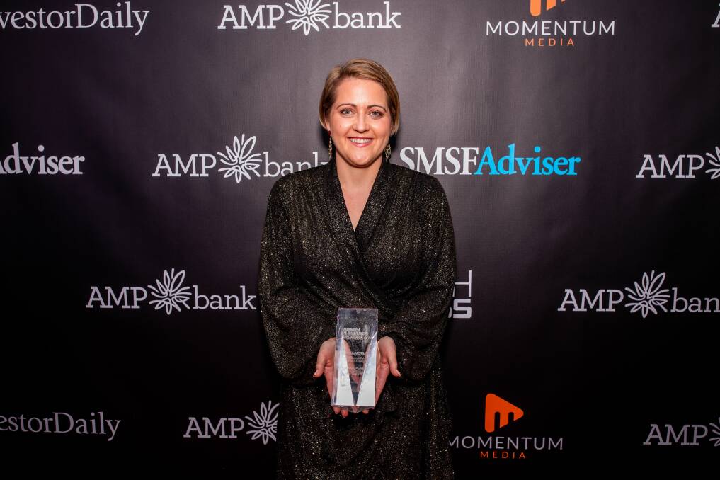 WINNER: Warrnambool financial planner Emma Arthur holding her national award for women in finance at a ceremony in Sydney. Picture: supplied