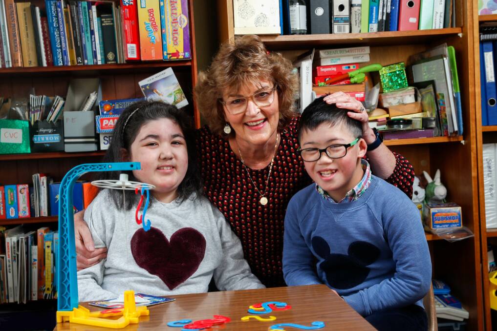 Siblings Naomi, 11, and Levi Philpot, 10, with speech pathologist Julie Johnstone. Picture: Chris Doheny