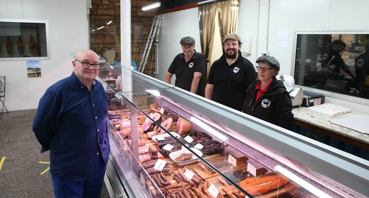 PAYING A VIST: Ginnane and Associates Martin Ginnane has been giving retail advice to Warrnambool business owners. He's pictured with Liebig Street's Crackling Smallgoods owners Ian and Brandon Lang and Dianne Harris. Picture: Mark Witte
