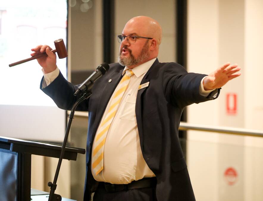 Jason Thwaites auctions a house at the Ray White auction event. Picture: Morgan Hancock