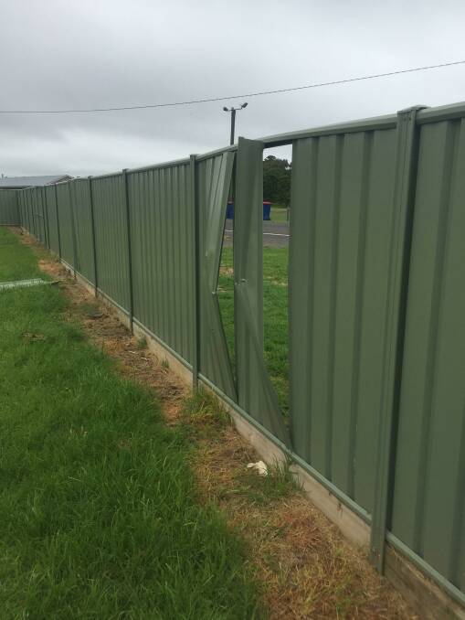 Vandalism: Damage to a fence at a private Port Fairy residence, in one of many incidents police are investigating.