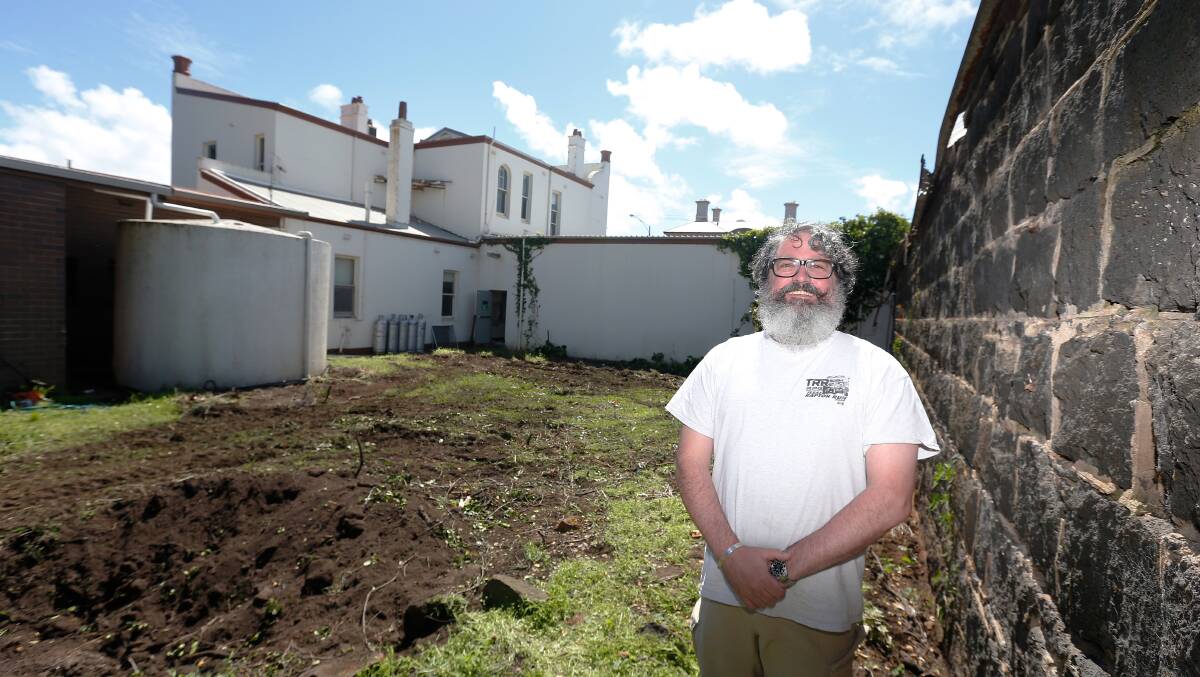 PLAN: Tim Sutherland in the site's back yard, where a beer garden is planned, in 2019. Picture: Mark Witte