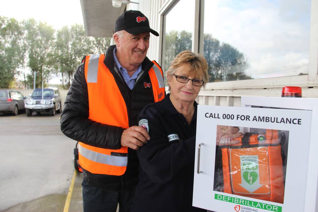 DONATION: Hawkesdale Community Emergency Response Team's Ros Stewart and cyclist Michael Meade at the launch on Tuesday. Picture: Jackson Graham