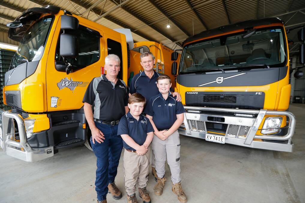 NEW HUB: Wheelie Waste staff Chris Philp, Gary Barton, Tommy Barton and Jack Barton are thrilled a glass facility in Warrnambool will go ahead. Picture: Anthony Brady