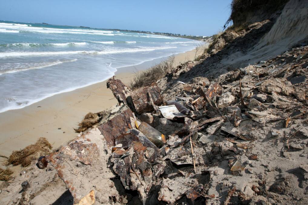 EROSION: Rubbish from the former tip on Port Fairy's East Beach before a rock wall was built to protect this section.