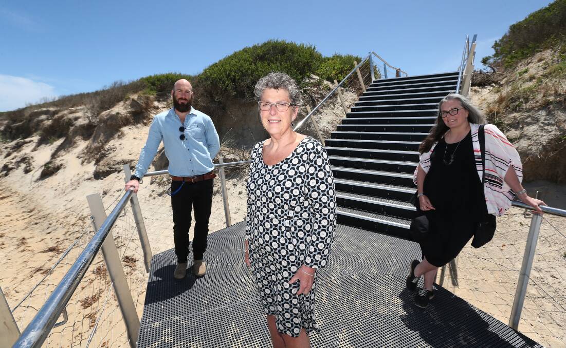 OPEN: Acting director city infrastructure Luke Coughlan, Warrnambool city council mayor Vicki Jellie and project coordinator Jen MacMillan at the opening of the beach access stairs. Picture: Mark Witte