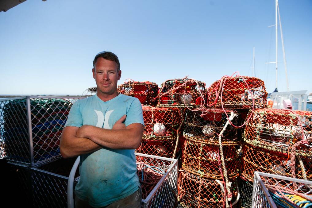 UNCERTAIN RETURN: Portland cray fish angler Callum McCarthy with empty pots when he and father David McCarthy pulled them out of the water due to the coronavirus in January. Picture: Anthony Brady