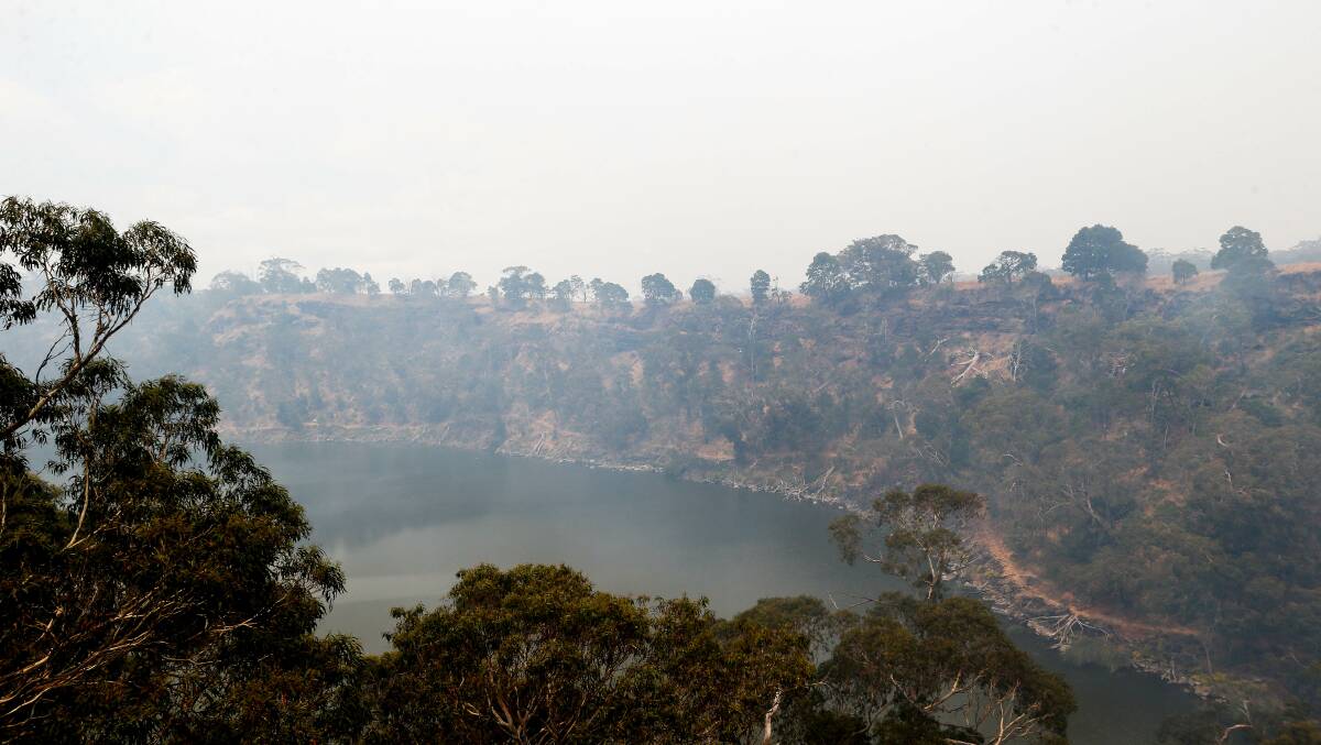 Smoke covered Lake Surprise, where the fire travelled into the crater for the first time in many community members' memories. Picture: Anthony Brady 