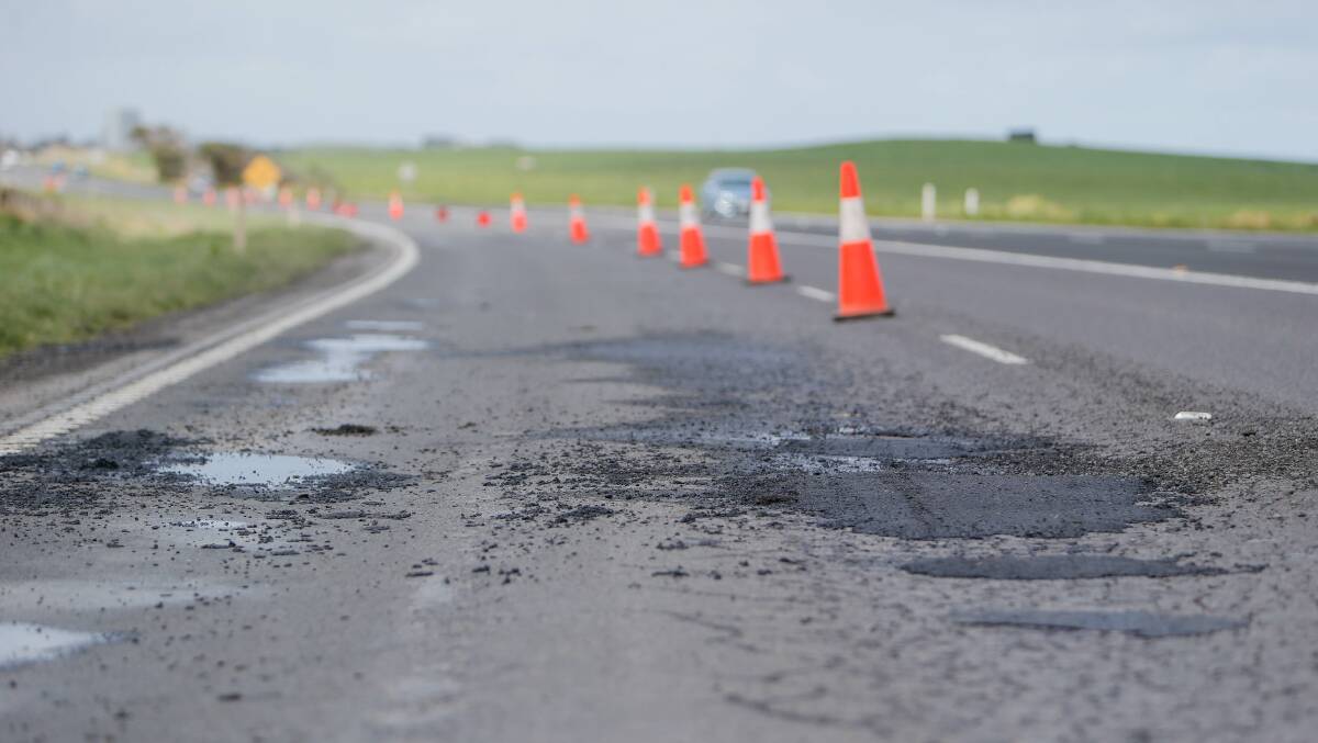 A lane on the highway between Warrnambool and Port Fairy was closed after damage from heavy September rain. Picture: Anthony Brady. 