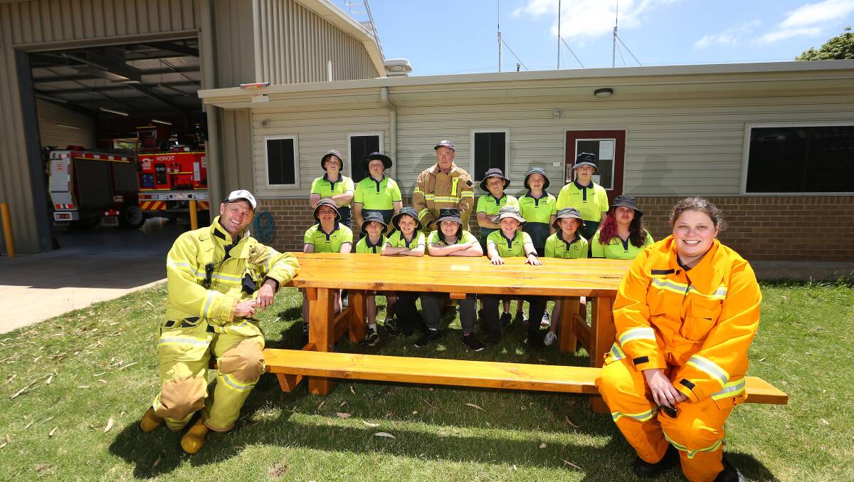 GOODWILL: Koroit and District primary school hands-on learners gifted the table to Koroit CFA members Alistair Cozens, Kelvin White and Ellen Gardiner. Picture: Mark Witte