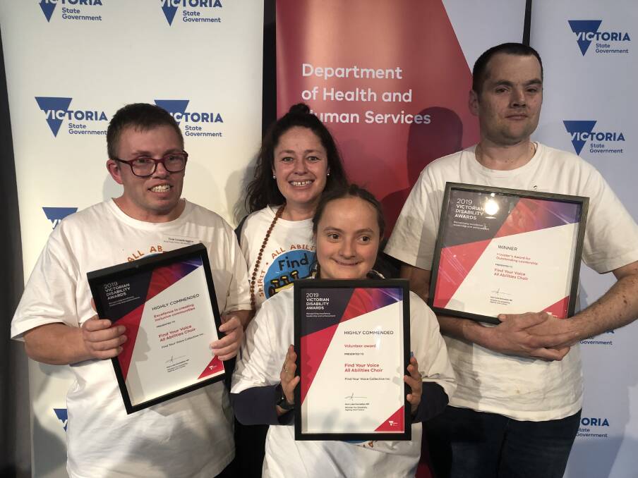 WINNERS: Tom Leembruggen, Kylie Thulborn, Celia Nash and Michael King were among the all-abilities choir members to accept the Minister's award on Wednesday.