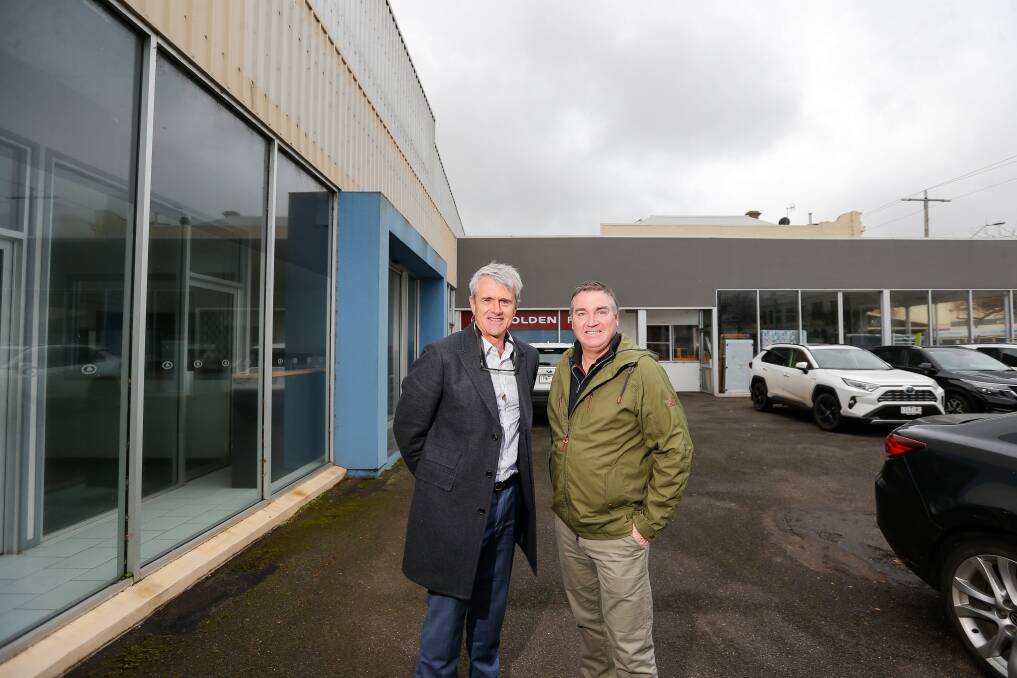BIG PLANS: Ludeman Real Estate agents Nigel Kol and Mark Dwyer at the old Callaghan's site in Warrnambool which could house a nine-storey apartment and commercial building. Picture: Anthony Brady