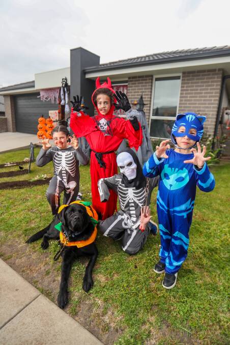 HAUNTING: Amiyus Cunningham, 9, Ava Gleeson, 8, Julian Purcell, 5, and Brooklyn Purcell, 9, alongside Doc the dog. Picture: Morgan Hancock