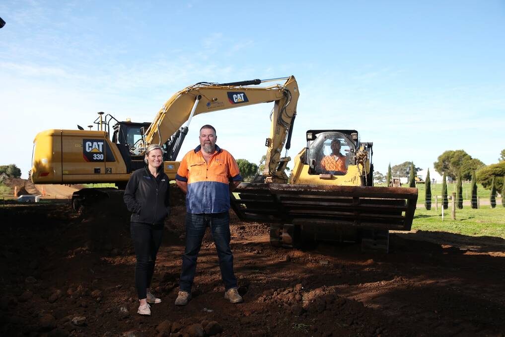 GIVING BACK: Earth and Water Technologies business development Carlie Ryan with senior operator Robert Delaney where works at Waters Lane in Mortlake have commenced. Picture: Mark Witte