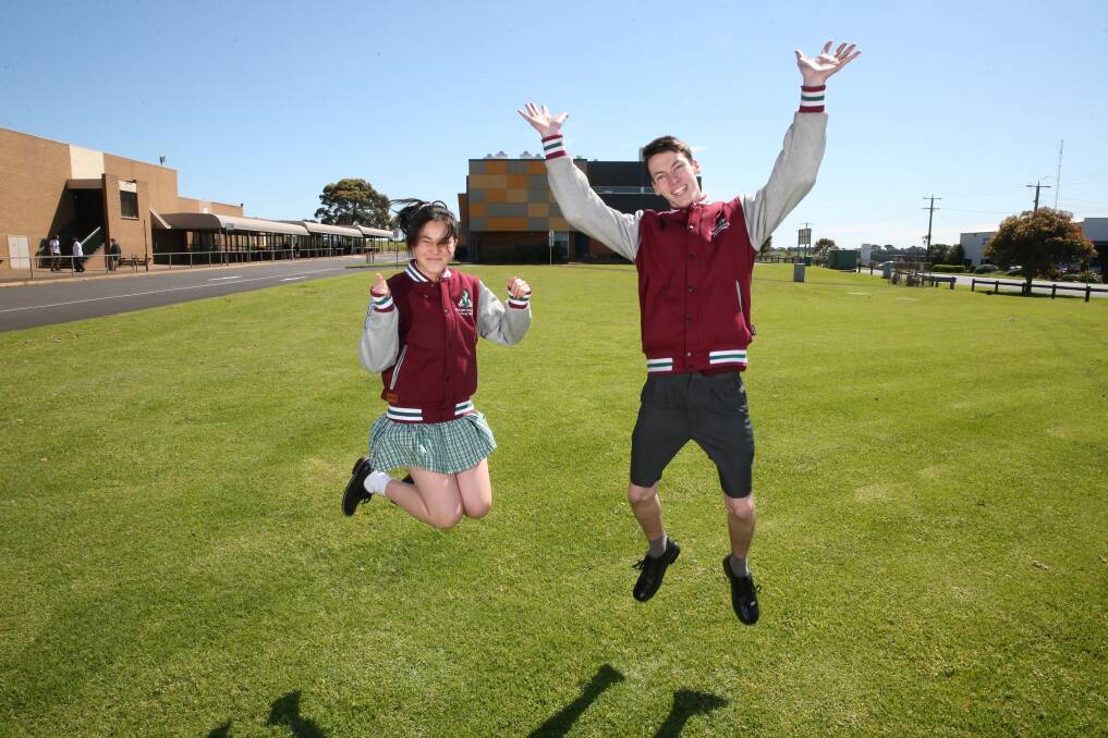 JUMP FOR JOY: Brauer college school captains Guan Bright, 17, and Tristan Gibbs, 18, back at school after lockdown. Picture: Mark Witte