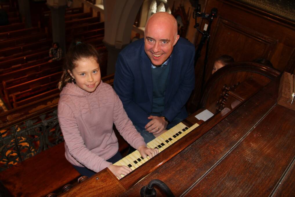 LEARNING: Misha Wear, 10, from Hamilton, was among children who received an introduction to the St Joseph's organ from acclaimed musician Thomas Heywood at the Warrnambool Organ Festival. Picture: Jackson Graham 