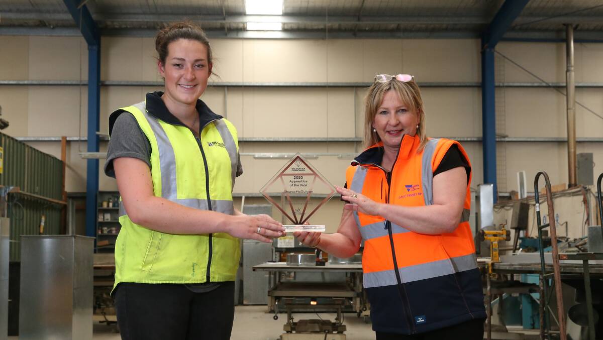 Cri-tech Plumbing Services Shona McGuigan is presented with the Victoria's apprentice of the year by Victorian Skills Minister Gayle Tierney. Picture: Mark Witte