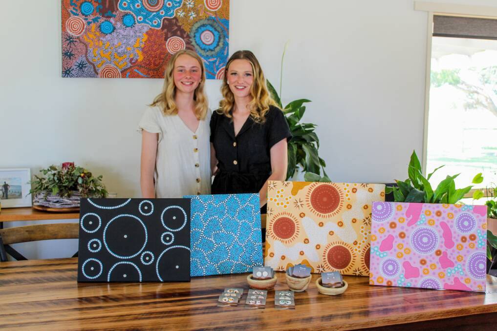 Sisters Coco and Asha Roche with their handmade paintings, pottery and earrings ahead of the launch of their new business, Sisterly. Picture: Kyra Gillespie