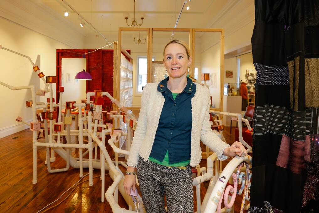 Warrnambool artist Becky Nevin-Berger with her new exhibiton at The F Project gallery. Picture: Anthony Brady