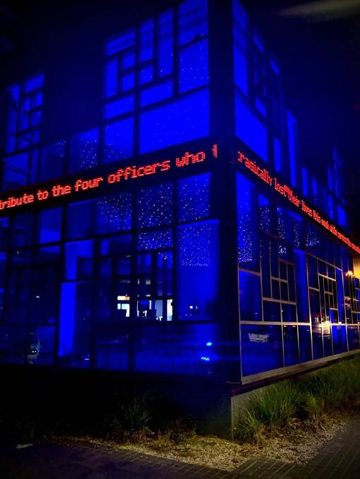 City theatre bathed in blue in tribute to fallen police officers