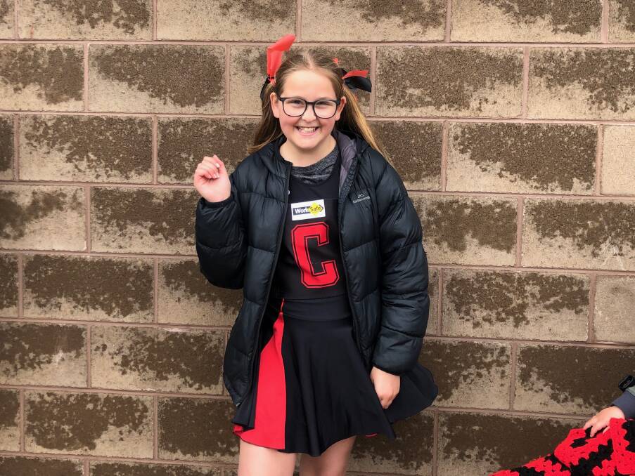 Cheering on: Matilda Anderson, 11, from Cobden supporting her friend Bec at the HFNL grand final. Picture: Kyra Gillespie 