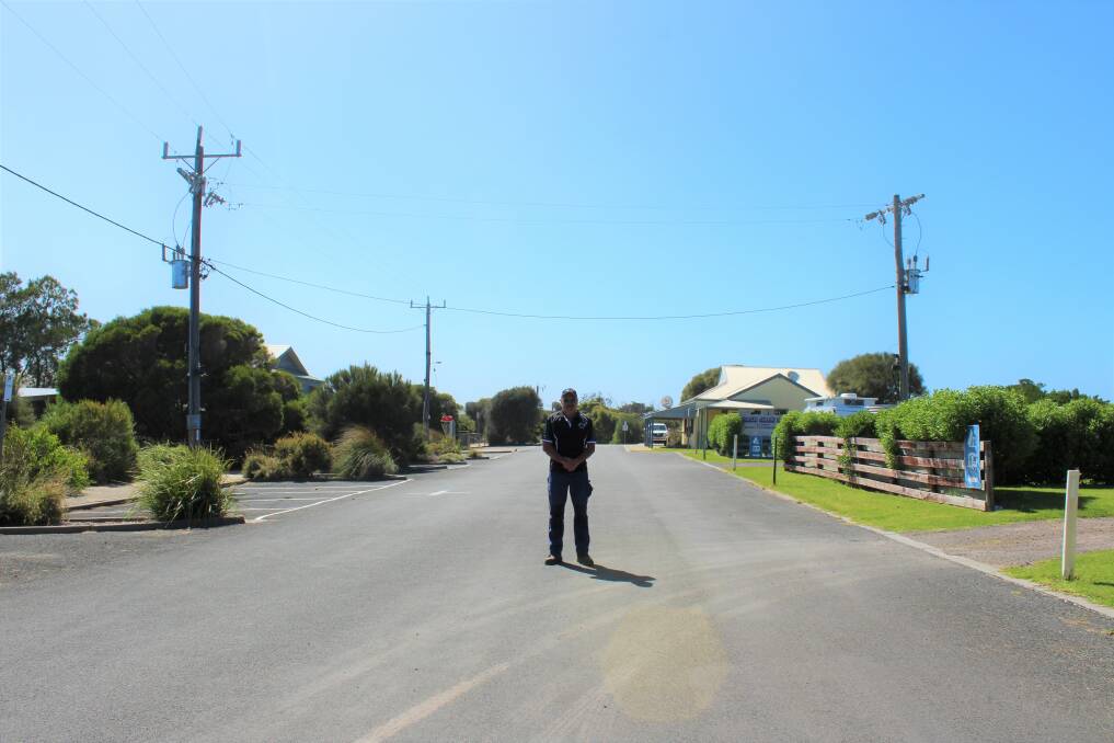 Princetown Recreation Reserve committee president Darin Blain stands in the main street of Princetown, where all the shops are shut. Picture: Kyra Gillespie