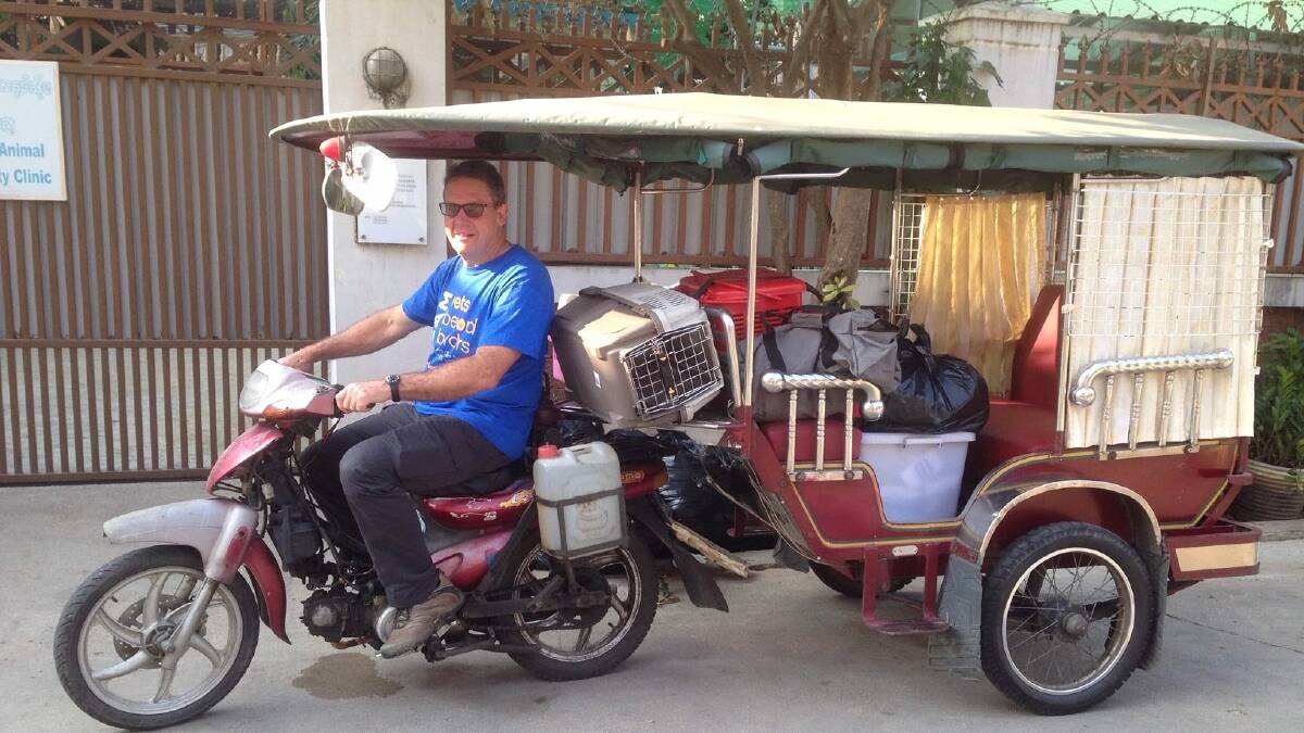 Cambodian transport: Dr Blackwood transports his veterinarian equipment the Cambodian way. 