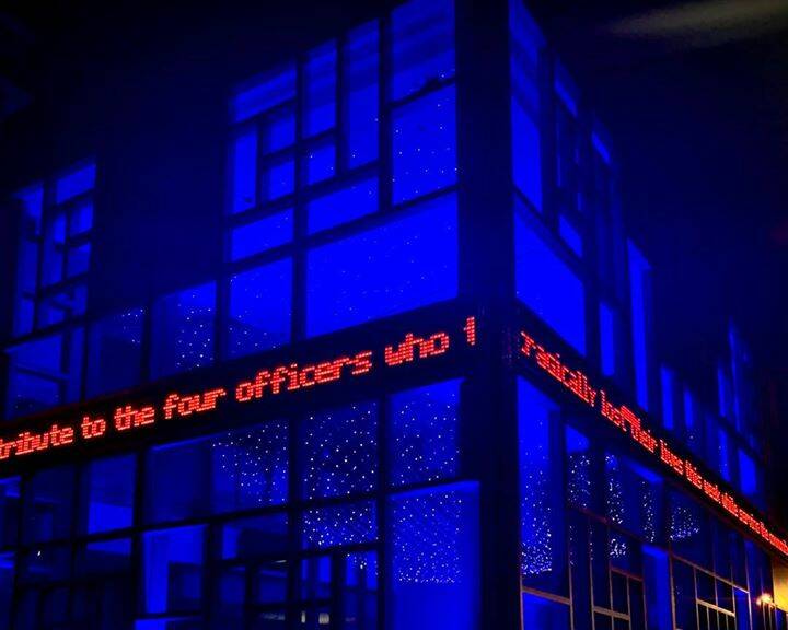 Fallen heroes: The Lighthouse Theatre was lit up in blue to pay tribute to the fallen police officers.