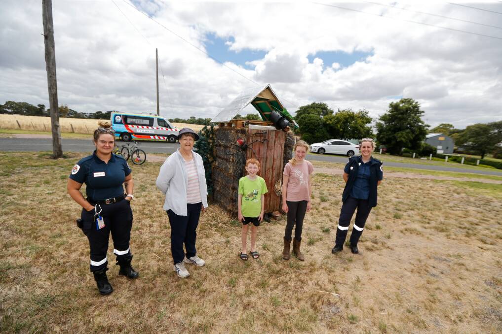 Jess McClure, Janine Davis, Lachie Lewis, Nessa Lewis and Mia Dempsey check out the 'Aussie Dunny' hay bale at Derrinallum as part of the Aussie Hay Bale Trail. Picture: Anthony Brady
