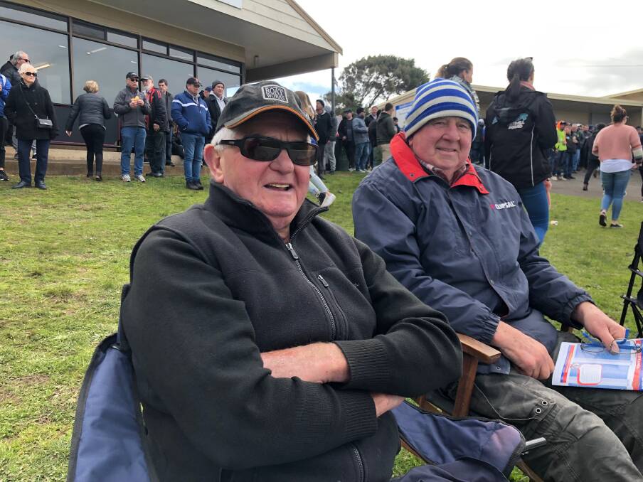Former players Brian Bartlett and Brian Doyle get close to the action on grand final day. 