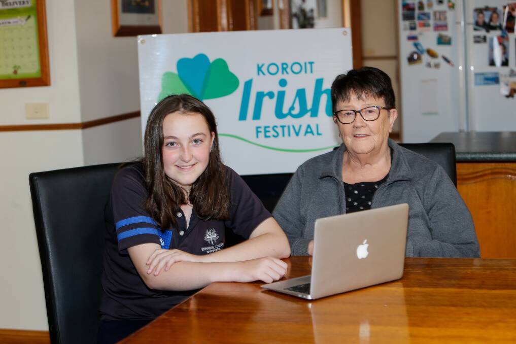 Festival: Milly Noonan helps her grandmother Trish Brody book her tickets online for the 2021 Koroit Irish Festival.