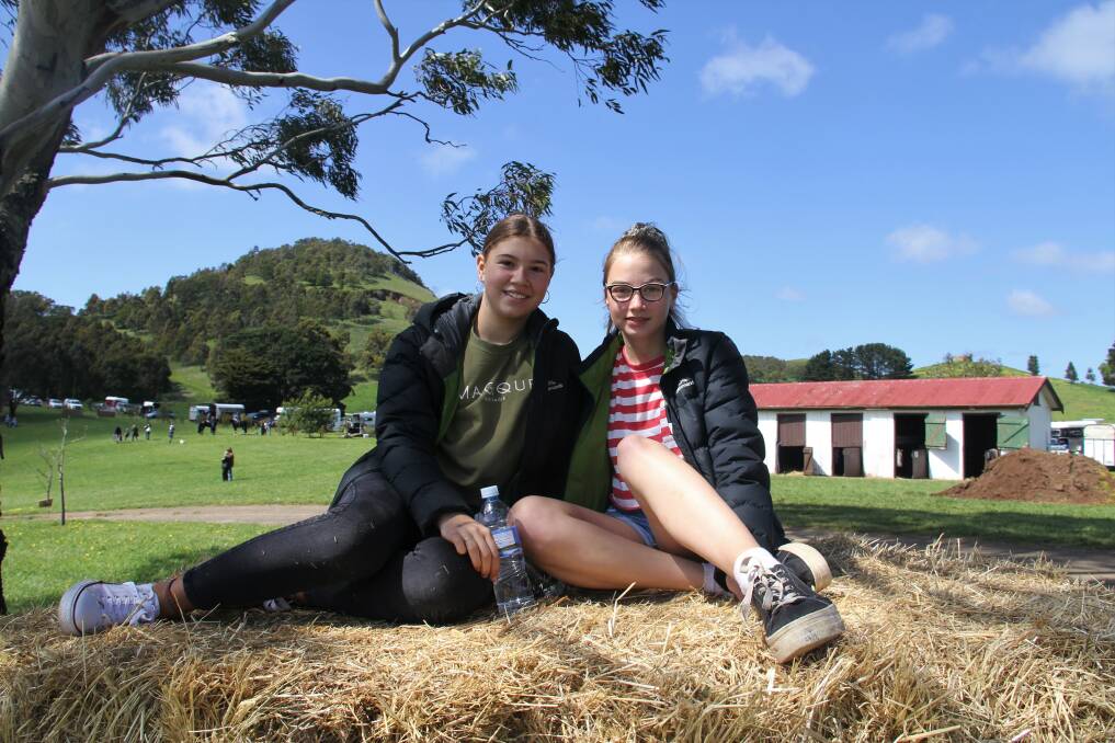 Fun: Camperdown friends Lily Hands and Ava Bentley, both 14, enjoy watching the horses. Picture: Kyra Gillespie