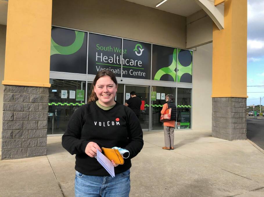 Port Fairy's Tess Dempsey, 19, received her COVID-19 vaccine this morning. She's seen the devastating impact on her family's restaurant and hopes life can get back to normal. 