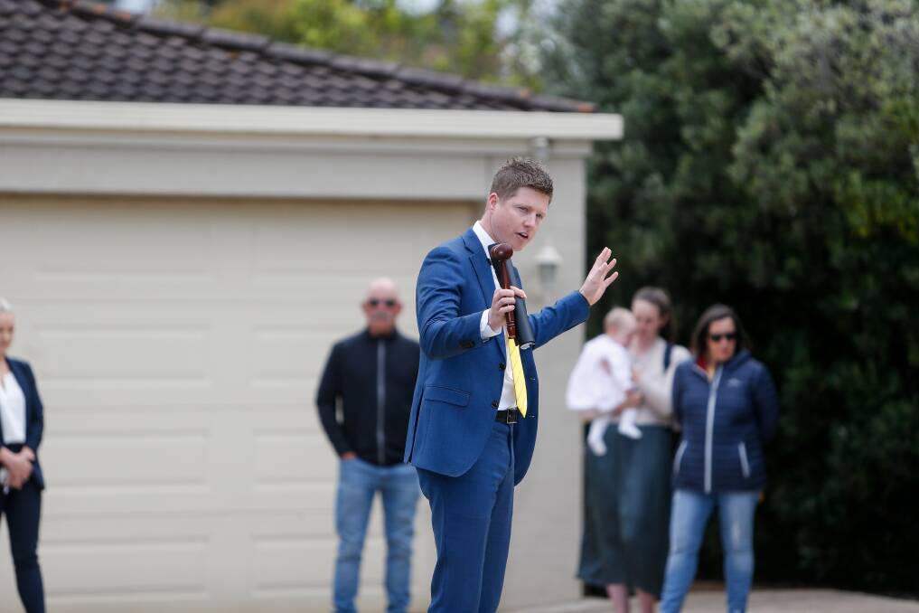 Auctioneer Fergus Torpy at 9 Banksia Drive in Warrnambool on Saturday. Picture: Anthony Brady