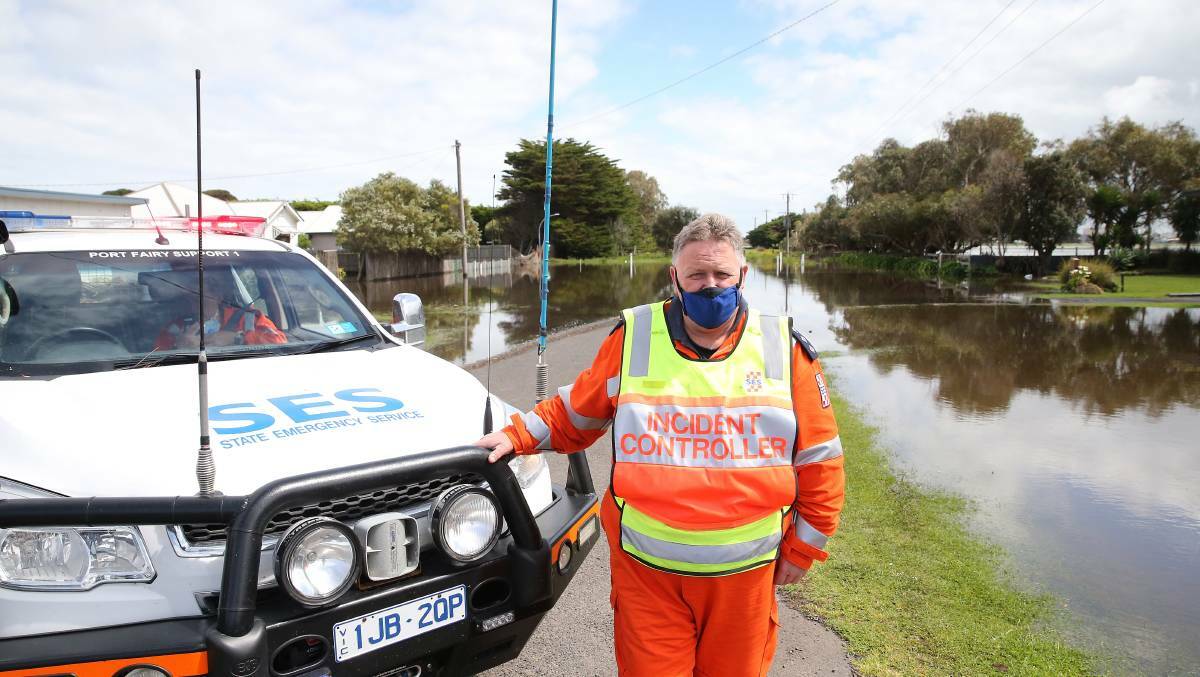 SEARCHING: Port Fairy SES Unit controller Stephen McDowell, pictured when Port Fairy flooded in October 2020, says the need for government funding for new headquarters is growing by the day. 