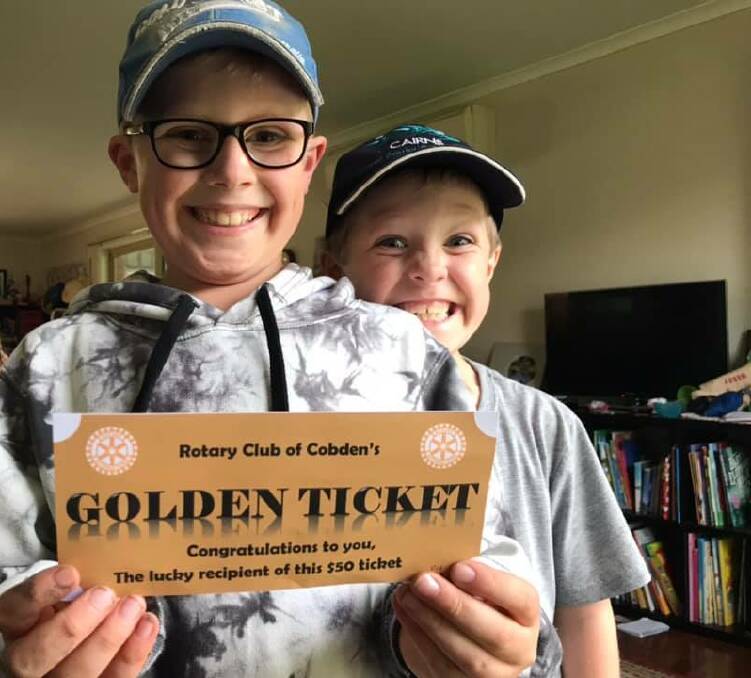 Cobden's Nathaniel, 8 and Henry, 6, were thrilled to win a 'Golden Ticket' to help support a Cobden business. Picture: Supplied