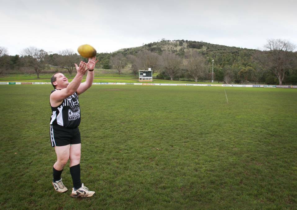 Helping out: Australia Day Award nominee Peter Conheady, during his days as Camperdown president, getting in some practice for his first reserves footy game (2007). He played because the reserves were struggling for numbers.