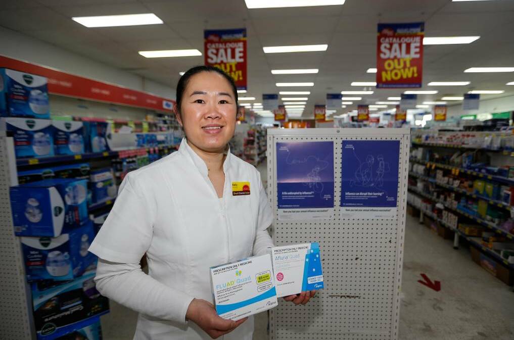 Direct Chemist Outlet pharmacist Kelly Tong with flu shots. Picture: Anthony Brady
