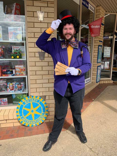 Cobden Rotary Club president Marcus Hooker dressed up as Willy Wonka, handing out golden tickets to lucky residents. Picture: Supplied
