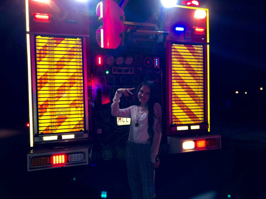 Stoked: Taliah posing with the firetruck. 