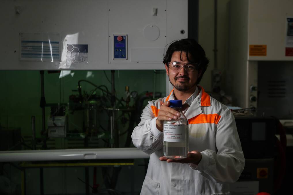 Sanitiser: George Mutch with some of the sanitiser made at Port Fairy's Sun Pharma factory. Picture: Morgan Hancock 