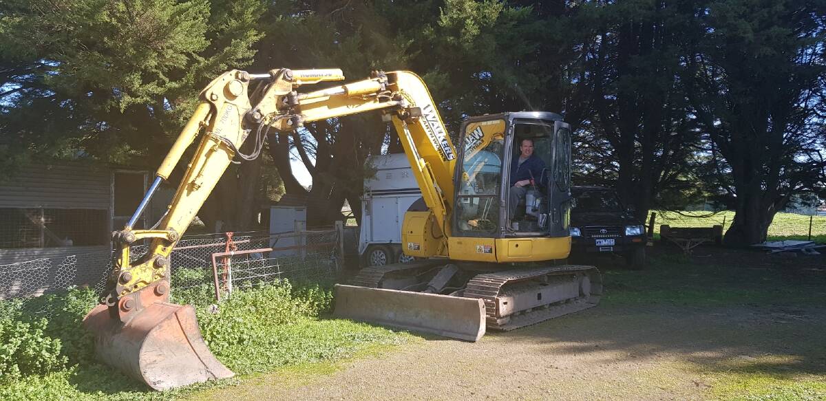 Triumph: Mr McArdle is back at work, operating heavy machinery again. 