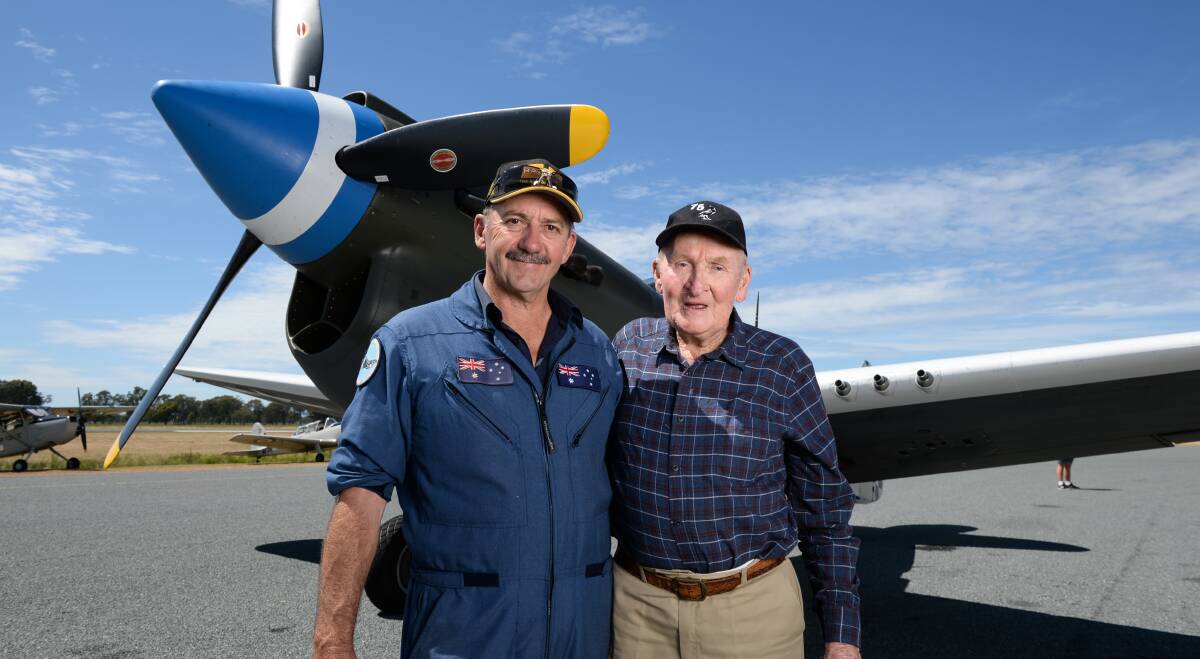 BOND: Classic Air Adventures owner Doug Hamilton embraces World War II veteran John Bailey before their Kittyhawk flight. Pictures: MARK JESSER 