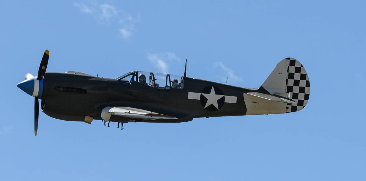 KITTYBOMBER: The historic P40 Kittyhawk in flight over Wangaratta on Sunday morning. It is the only two-seater flying in Australia, and saw action in World War II.