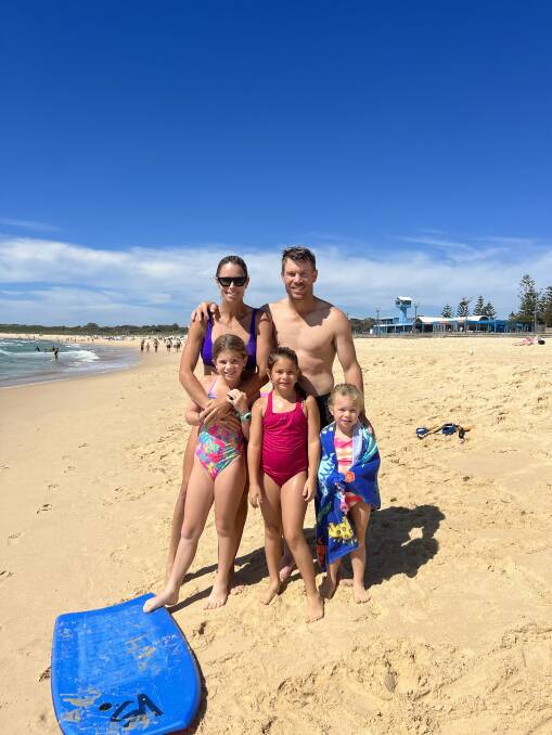 Candice and David Warner with their daughters, left to right, Ivy Mae, Indi Rae and Isla Rose, at Maroubra Beach in 2022. Picture supplied