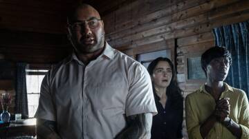 Dave Bautista, left, Abby Quinn, and Nikki Amuka-Bird in Knock at the Cabin. Picture Universal Studios