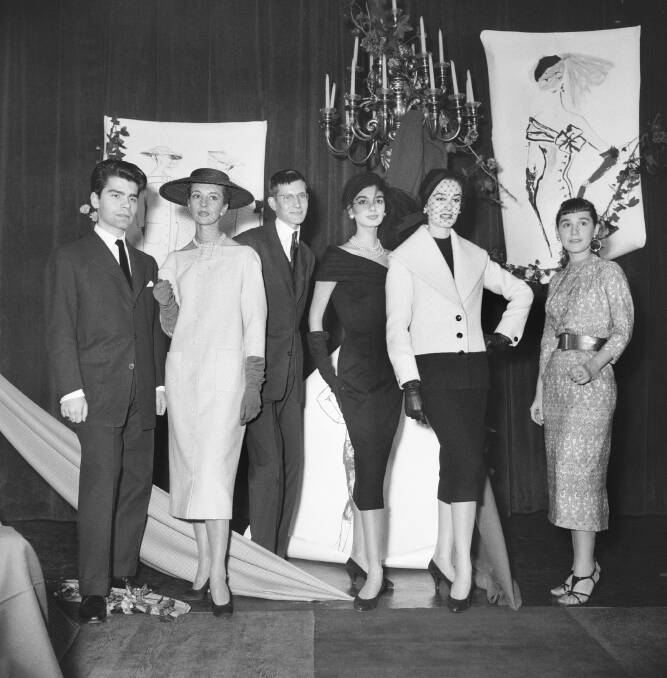 HIGH PROFILE WINNER: A young Yves St Laurent (far left) at the International Woolmark Prize awards in 1954. 