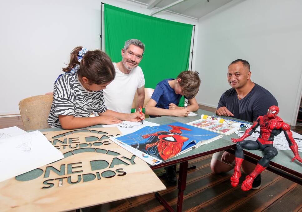 Digital natives: One Day Studio founders Gareth Colliton and Richard Pritchard help Sierra Pritchard, 10, and Jett Burgess, 12, with their illustrations.