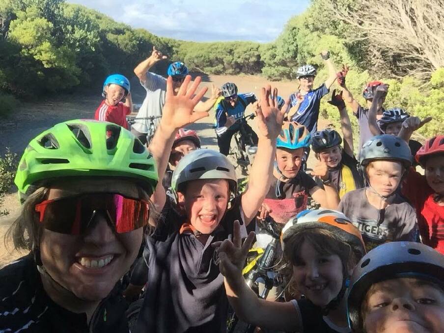 Coaching: Mia Easton (left) with participants on the Warrnambool Mountain Bike Club junior skills program.