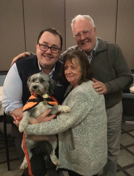 Graduation: Hearing assistance dog Quincey receives her accreditation in September, with David Horne, CEO Australian Lions Hearing Dogs, Valma Strachan, and Rob Cameron, Australian Lions Hearing Dogs district chairman. Picture: Anne-Maree Maguire